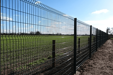A high level fence of approximately 2m, with secure posts and a mesh between to allow for visual connection between the spaces