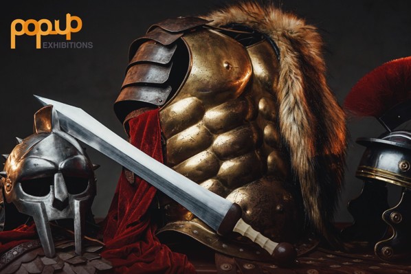 A poster for Hollywood Rome. It has Roman armour, helmets, and a sword on display.